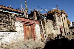 08 People On The Roofs Of Houses In Nar Village Stacked With Hay And Cows Down Below 